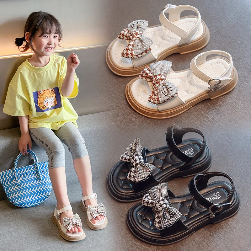 Сандалии для девочек Корейская версия, Обувь принцессы с мягким дном и бантом, Лето 2023, Новый стиль, Модные Детские сандалии для маленьких девочек . ' - ' . 0